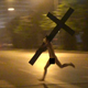 Illustration for article titled Oh Hey, Its a Naked Man on a Scooter, Carrying a Crucifix